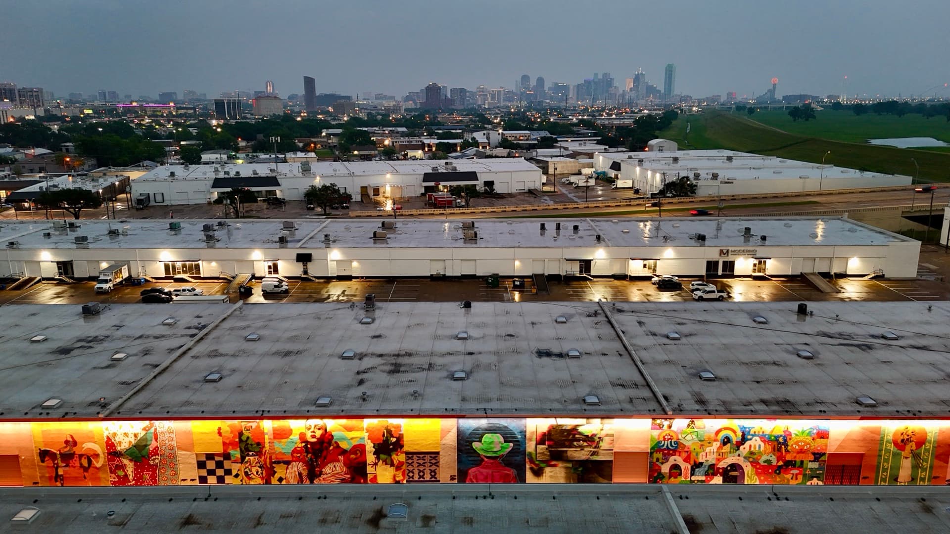 Aerial drone photo of BearcatTurf ArtDocks installation with Dallas skyline at dusk